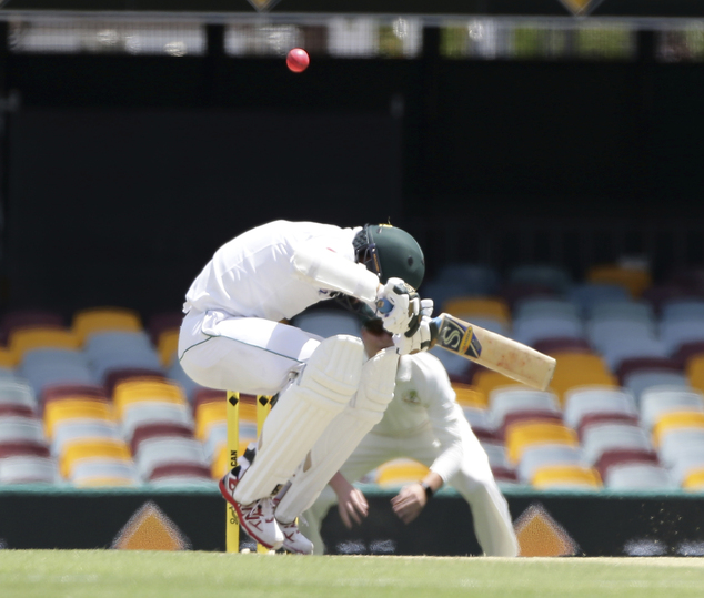 Pakistan's Muhammad Amir ducks under a bouncer during play on day three of the first cricket test match between Australia and Pakistan in Brisbane Australia