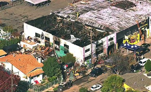 This Dec. 3 2016 image from video provided by KGO-TV shows the Ghost Ship Warehouse after a fire that started late Friday swept through the Oakland Calif. building. Dozens of people are confirmed dead with the toll expected to rise