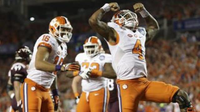 Clemson quarterback Deshaun Watson celebrates his touchdown during the second half of the Atlantic Coast Conference championship NCAA college football game against Virginia Tech Saturday Dec. 3 2016 in Orlando Fla