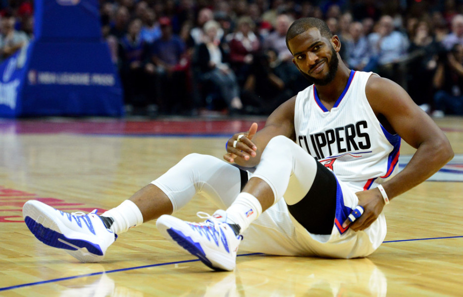 Los Angeles Clippers guard Chris Paul goes down hard as he holds his hip against the Dallas Mavericks in the first quarter during an NBA basketball game in Los Angeles Calif. on Thursday Oct. 29 2015