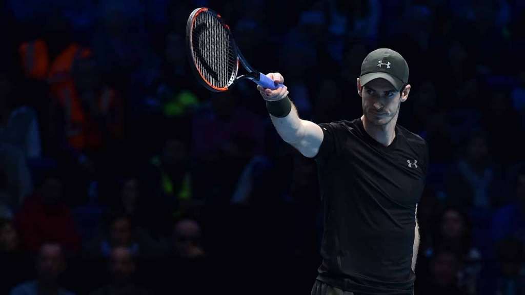 Britain's Andy Murray gestures to his team during his men's semi-final singles match against Canada's Milos Raonic on day seven of the ATP World Tour Finals tennis tournament in London