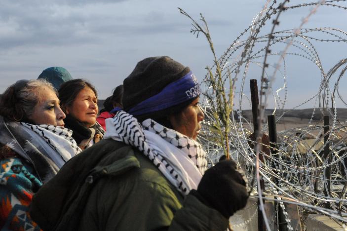 Women hold a prayer ceremony on Backwater Bridge during a protest against plans to pass the Dakota Access pipeline near the Standing Rock Indian Reservation near Cannon Ball North Dakota