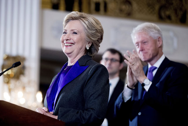 Hillary Clinton accompanied by former President Bill Clinton right pauses while speaking to staff and supporters at the New Yorker Hotel in New York Wednesday Nov. 9 2016 where she conceded her defeat to Republican Donald Trump after the hard-fough