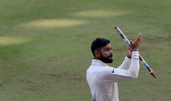 Virat Kohli acknowledges the support of Mumbai crowd at the Wankhede after winning the series