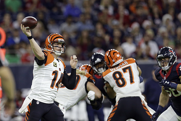 APCincinnati Bengals quarterback Andy Dalton (14&#41 throws a pass against the Houston Texans during the first half of an NFL football game Saturday Dec. 24 2016 in Houston