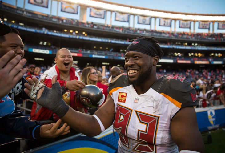 Tampa Bay Buccaneers defensive tackle Gerald Mc Coy high-fives fans following a victory against the San Diego Chargers at Qualcomm Stadium in San Diego Calif. on Sunday Dec. 4 2016