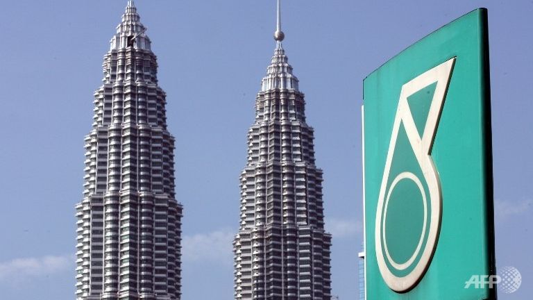 The Petronas twin towers is seen behind the company coporate logo in downtown Kuala Lumpur.      
   Enlarge  Caption