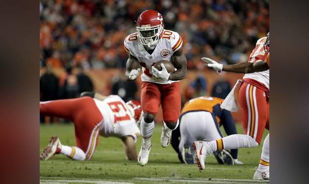 Kansas City Chiefs wide receiver Tyreek Hill runs after the catch against the Denver Broncos during the first half of an NFL football game in Denver. The Kansas City Chiefs and Atlanta Falcons have fou