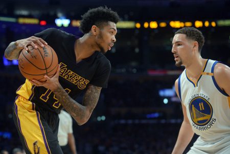 Los Angeles Lakers forward Brandon Ingram controls the ball against Golden State Warriors guard Klay Thompson during the second half at Staples Center