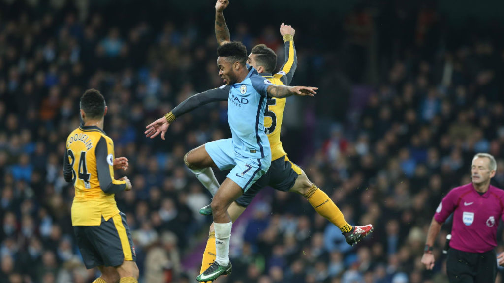 JUMP TO IT Sterling contests an aerial ball