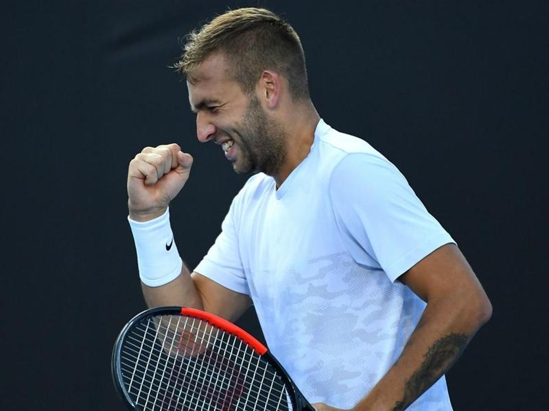 Dan Evans celebrates his win over Marin Cilic