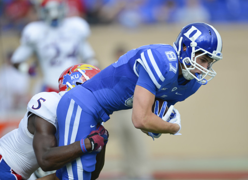 Sept. 13 2014- Max Mc Caffrey of Duke is brought down by Isaiah Johnson of Kansas. The Duke Blue Devils hosted Kansas Jayhawks at Wallace Wade Stadium in Durham N.C. Duke won 41-3