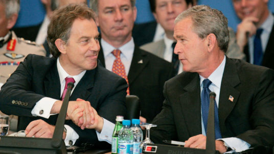 George W. Bush shakes hands with Tony Blair during the NATO Summit in Istanbul Turkey 2004