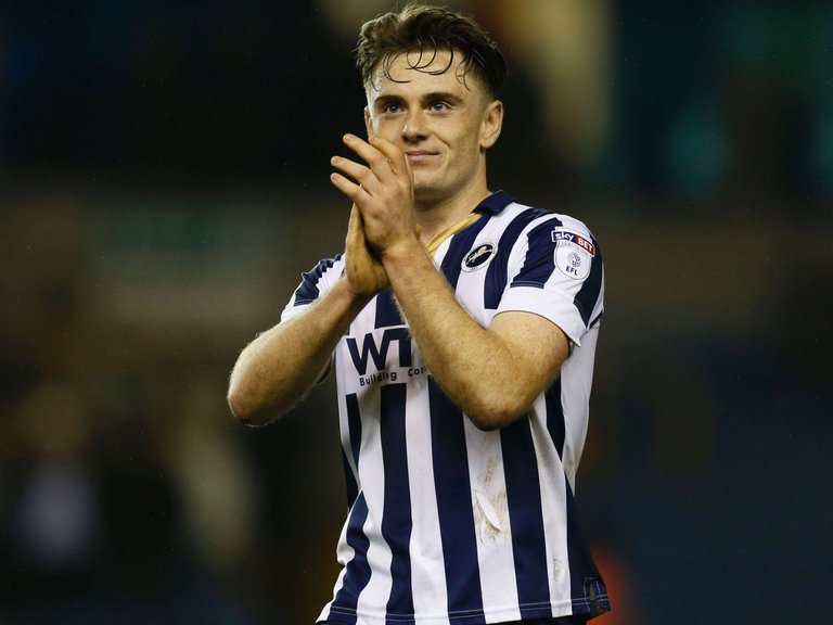 Millwall midfielder Ben Thompson applauds supporters after his side's victory