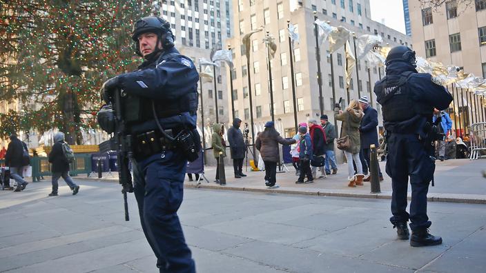 New York City Police patrol near the Christmas tree at Rockefeller Center Tuesday Dec. 20 2016 in New York