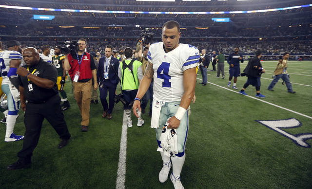 Dallas Cowboys rookie quarterback Dak Prescott walks off the field Sunday after a 34-31 loss to the Green Bay Packers in an NFC semifinal at AT&T Stadium in Arlington Texas