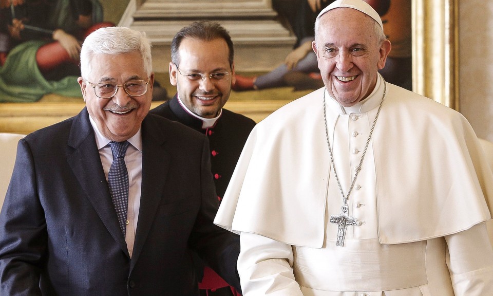 Pope Francis greets Palestinian President Mahmoud Abbas at the Vatican on January 14