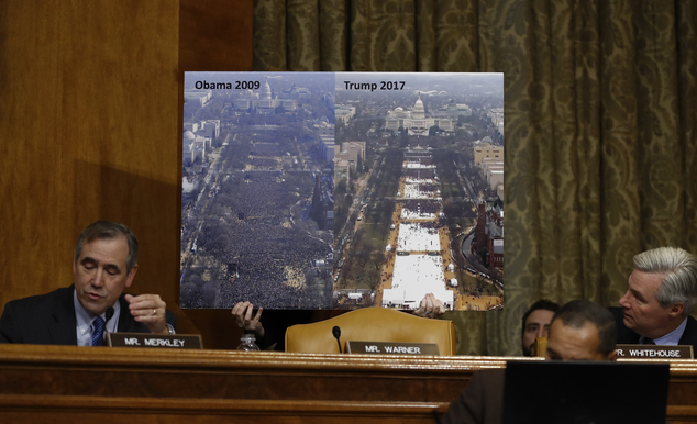 Senate Budget Committee members Sen. Jeff Merkley D-Ore. left and Sen. Sheldon Whitehouse D-R.I. flank a large