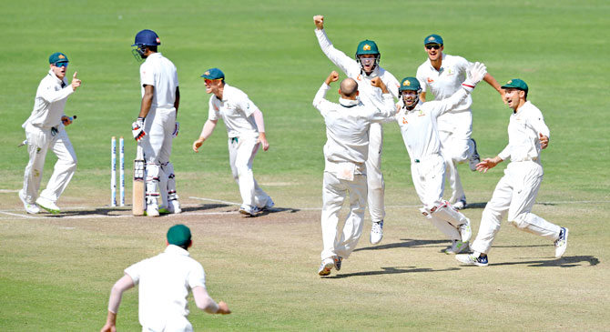 Australian cricketers celebrate after winning the first Test against India in Pune on Saturday. Pic  AFP