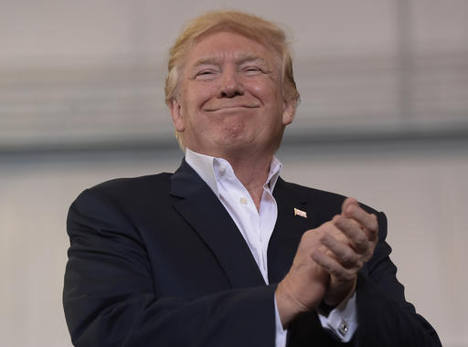 President Donald Trump smiles as he prepares to speak at his'Make America Great Again Rally at Orlando Melbourne International Airport in Melbourne Fla. Saturday Feb. 18 2017