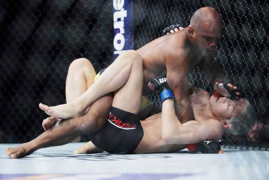 Wilson Reis top of Brazil top grapples with Ulka Sasaki of Japan during a flyweight mixed martial arts bout at UFC 208 on Saturday Feb. 11 2017 in New York. Reis won the bout