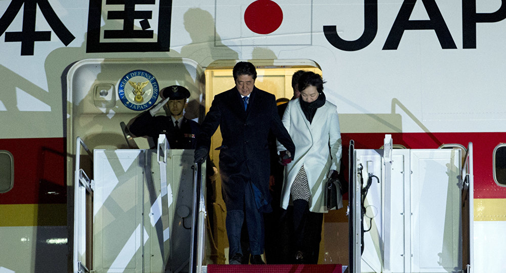 Japanese Prime Minister Shinzo Abe and his wife Akie steps off from their plane upon they arrival at Andrews Air Force Base Md. Thursday Feb. 9 2017