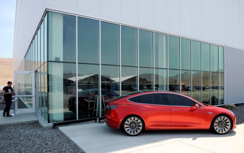 REUTERS  James Glover IIA prototype of the Tesla Model 3 is on display in front of the factory during a media tour of the Tesla Gigafactory