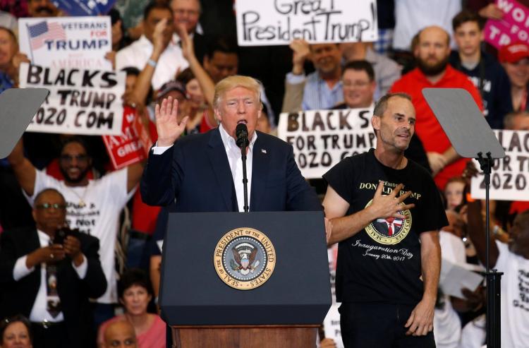 The rally took a surreal turn when Trump invited a supporter to speak on stage