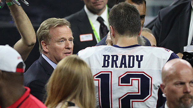 NFL commissioner Roger Goodell speaks to Tom Brady #12 of the New England Patriots after defeating the Atlanta Falcons during Super Bowl 51 at NRG Stadium