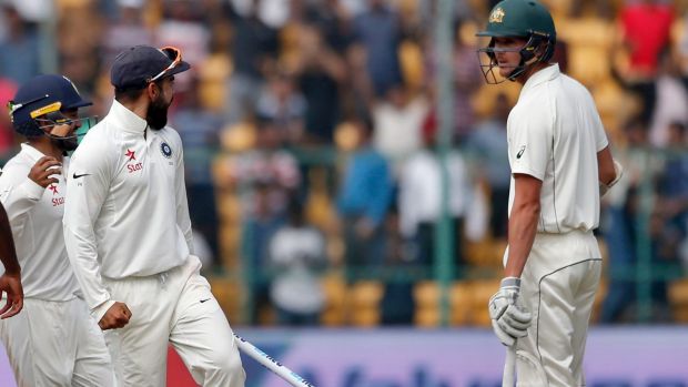 India's captain Virat Kohli second right gestures to Australia's Josh Hazlewood after their win