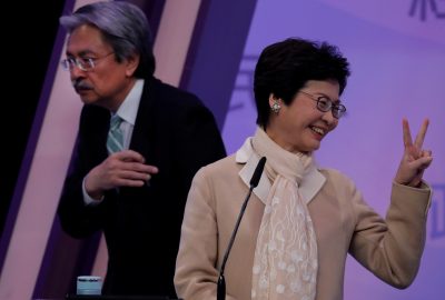 Hong Kong Chief Executive candidates former Financial Secretary John Tsang and former Chief Secretary Carrie Lam react at a debate in Hong Kong China 14 March 2017