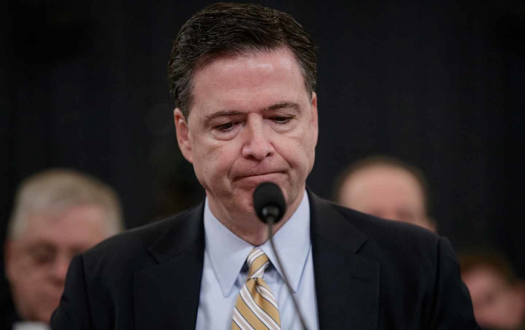 FBI Director James Comey pauses as he testifies before a House Intelligence Committee hearing