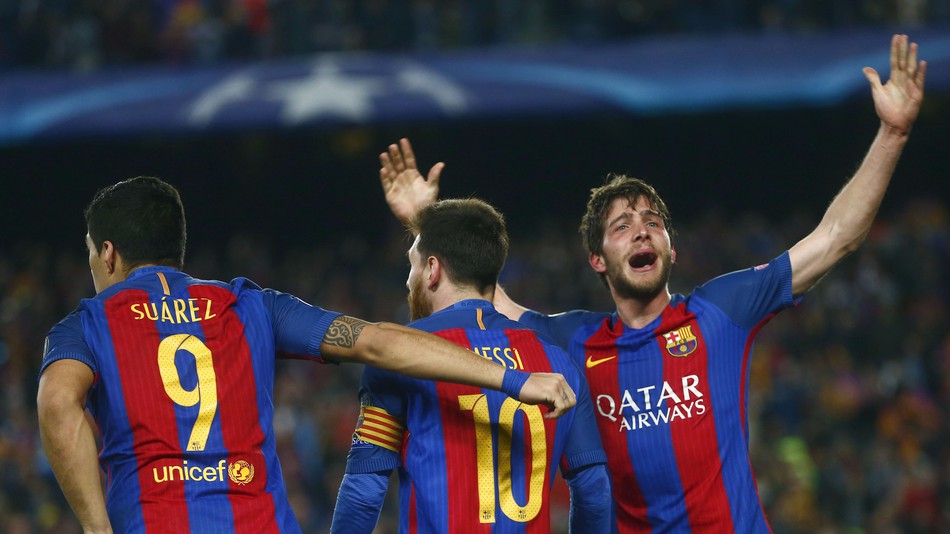 FC Barcelona's Sergi Roberto, right celebrates with Lionel Messi and Luis Suarez