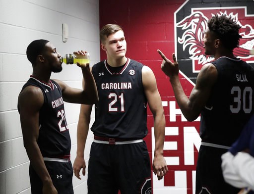 South Carolina's Justin Mc Kie, Maik Kotsar and Chris Silva talk after a practice session for their NCAA Final Four tournament college basketball semifinal game Thursday