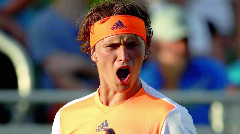 Germany’s Alexander Zverev celebrates after his 4-6 6-2 6-1 win over Stan Wawrinka of Switzerland in their Miami Open match at the Crandon Park Tennis Center in Key Biscayne Florida