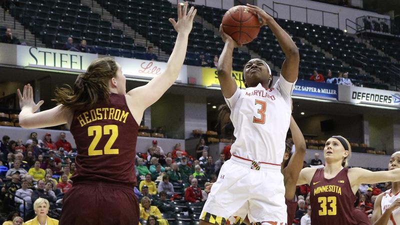 Maryland guard Kaila Charles shoots between Minnesota guards Joanna Hedstrom and Carlie Wagner during the first half