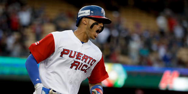 Puerto Rico's Carlos Correa celebrates a two-run home run against the Netherlands