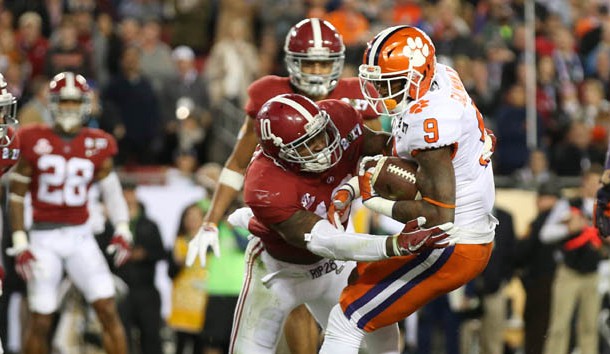 Former Alabama Crimson Tide linebacker Reuben Foster tackles Clemson Tigers running back Wayne Gallman (9 in the 2017 College Football Playoff National Championship Game at Raymond James Stadium