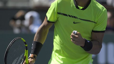 Rafael Nadal of Spain reacts after winning a point against Fernando Verdasco of Spain at the BNP Paribas Open tennis tournament Tuesday