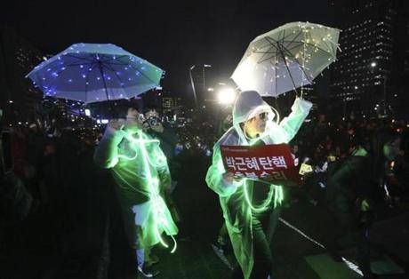 Protesters called for the arrest of impeached South Korean President Park Geun-hye in Seoul on Friday. A court ordered Geun-hye out of office because of a corruption scandal