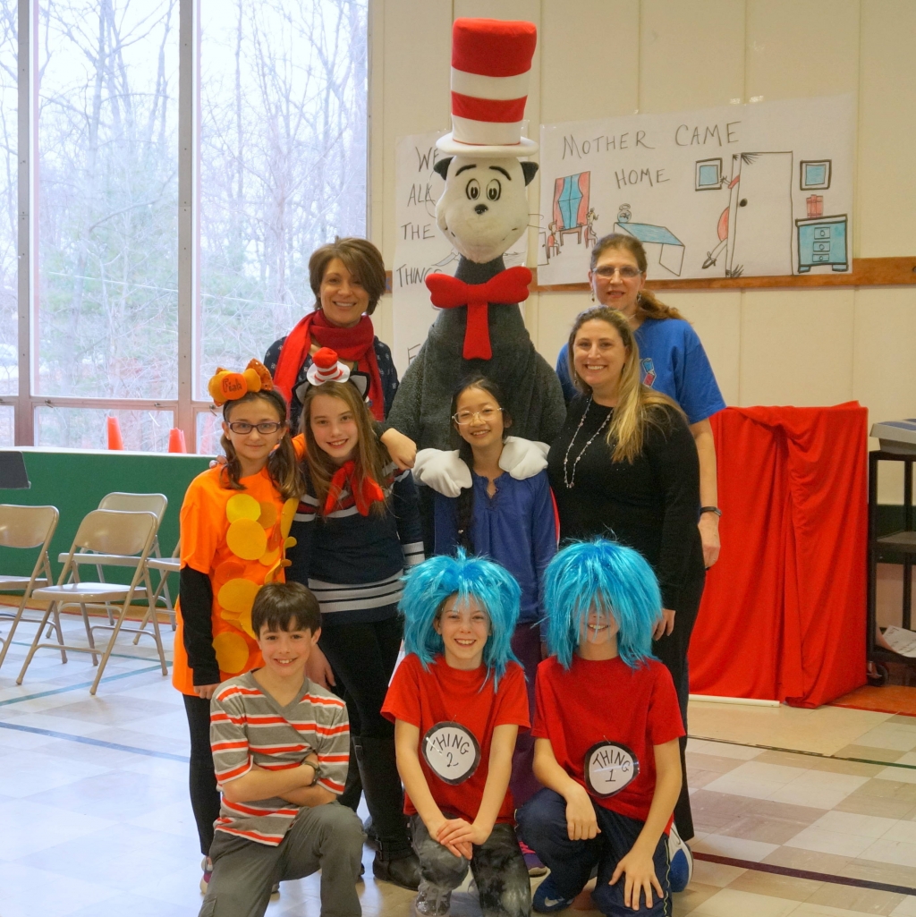 The Cat in the Hat visits William Mason Elementary and poses with students and teachers
Credits Melissa Benno