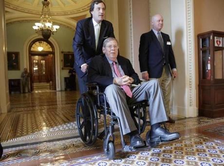 US Senator Johnny Isakson who was recovering from back surgery is wheeled away from the Senate chamber on Capitol Hill in Washington Thursday