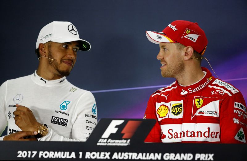 Formula One- F1- Australian Grand Prix- Melbourne Australia- 26/03/2017- Ferrari driver Sebastian Vettel of Germany speaks with second-placed Mercedes driver Lewis Hamilton of Britain at the post-race press conference. REUTERS  Brandon Malone