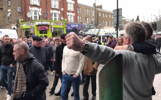 Millwall fan punches Tottenham rival amid accusations of racist abuse