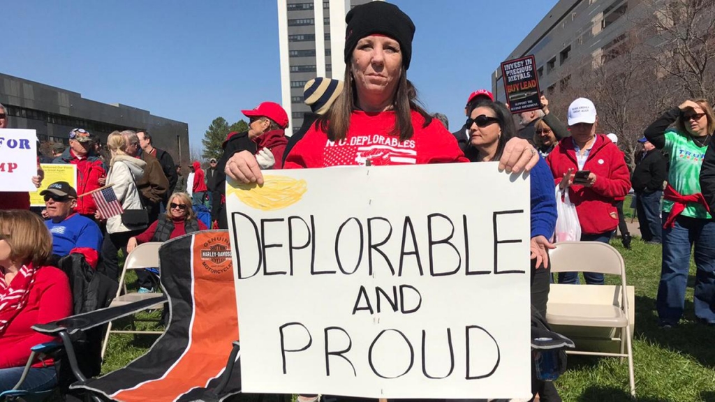 A woman holds a sign at a pro Donald Trump rally in Raleigh on March 4