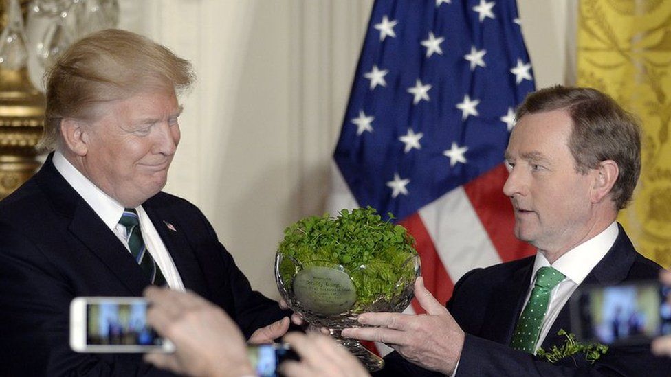 Enda Kenny presenting Donald Trump with shamrocks