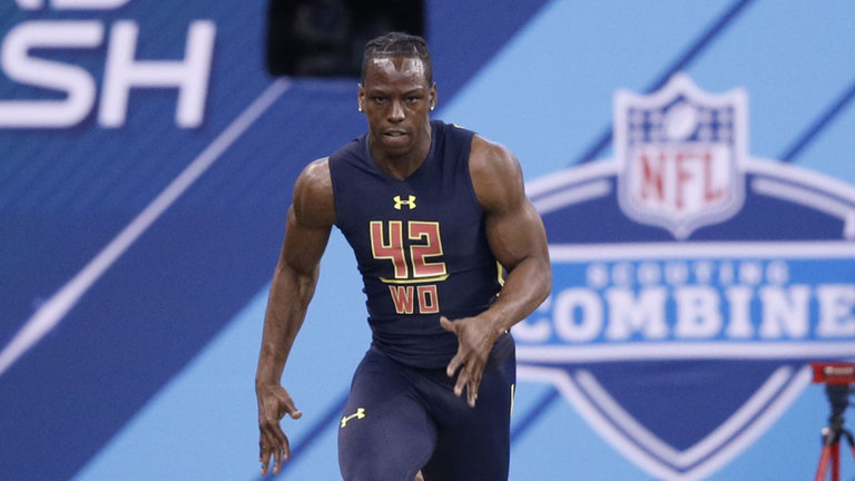 Wide receiver John Ross of Washington runs the 40-yard dash in 4.22 seconds