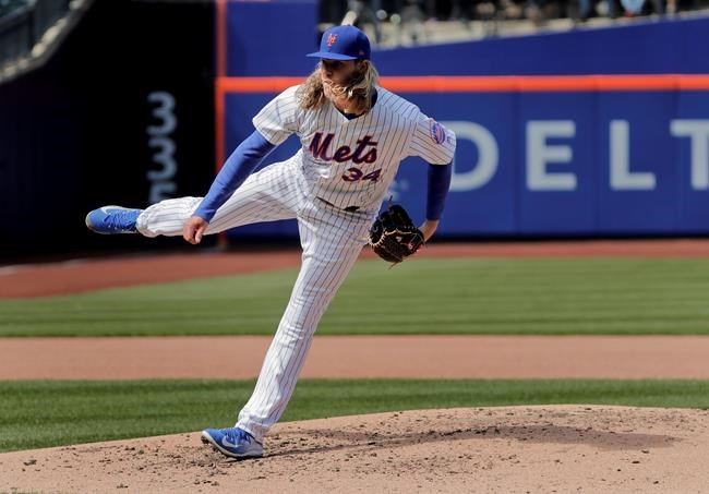 New York Mets pitcher Noah Syndergaard delivers against the Atlanta Braves during the fourth inning of a baseball game Monday