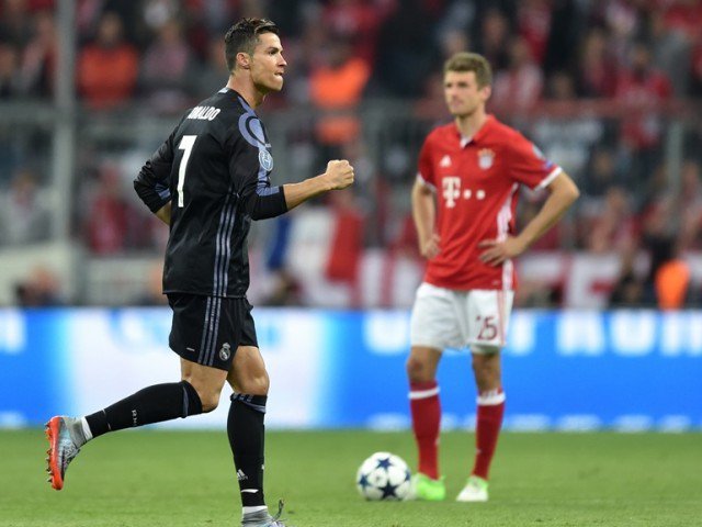 Real Madrid's Portuguese striker Cristiano Ronaldo reacts after his first goal during the UEFA Champions League 1st leg quarter-final football match FC Bayern Munich v Real Madrid in Munich southen Germany