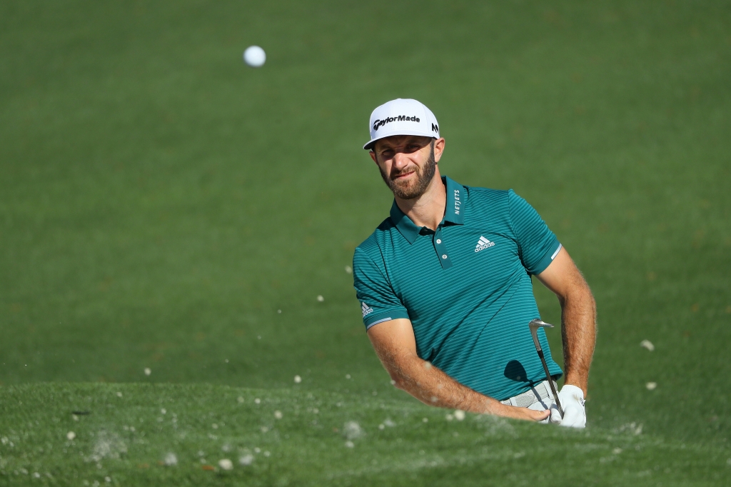 Dustin Johnson plays a shot from a bunker at Augusta National Golf Club